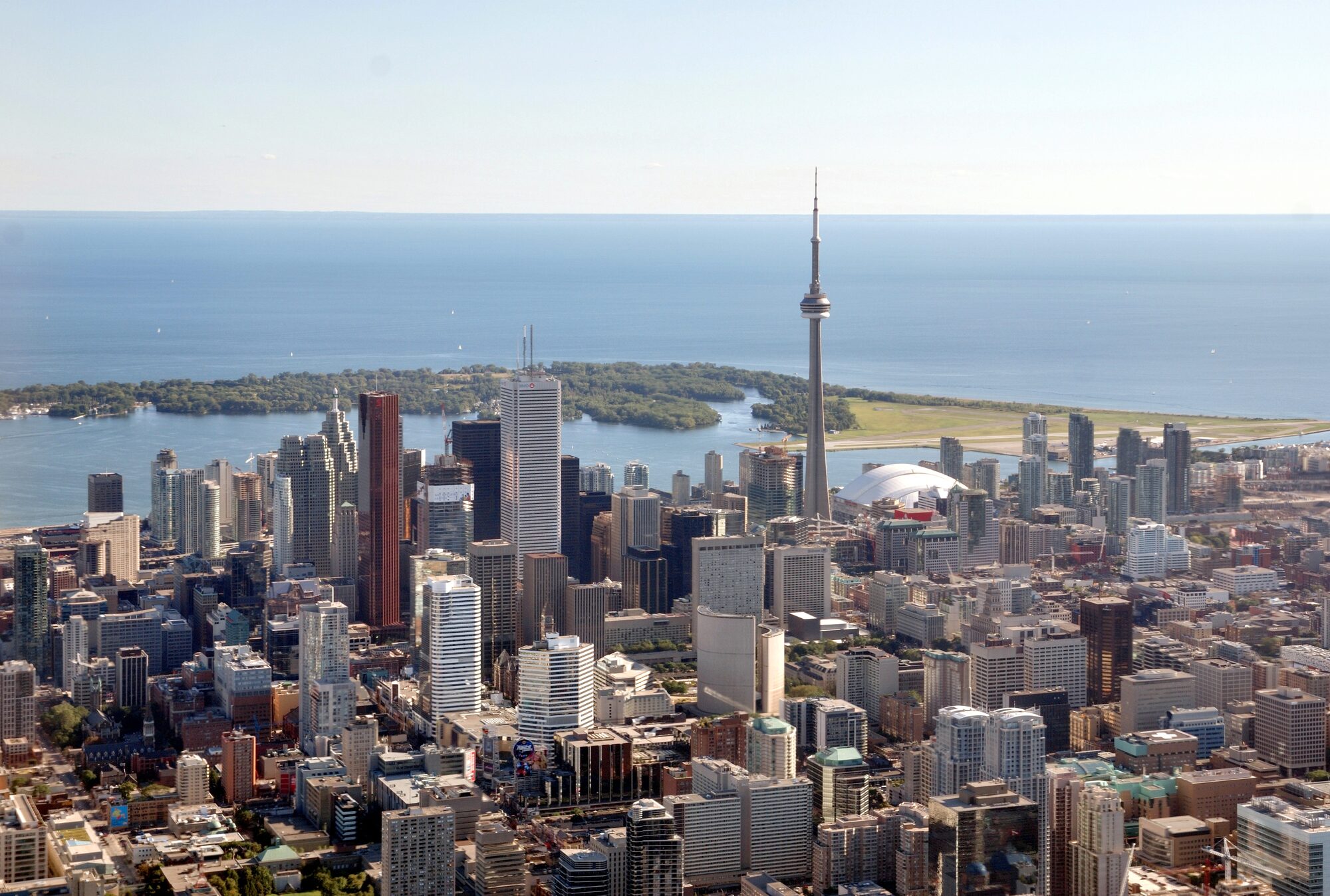 Aerial view of the Toronto skyline over Lake Ontario — the largest of the metropolitan areas the 2026 Census will recount