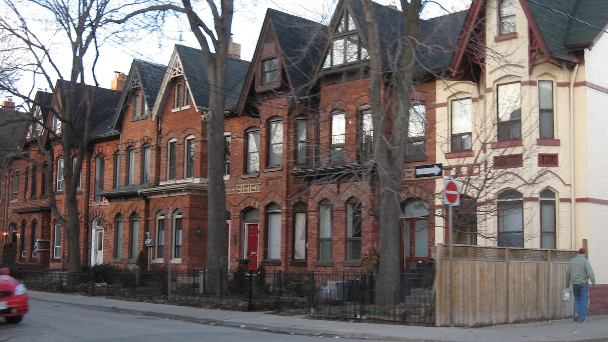 A row of Victorian-era Toronto row houses on a residential street — typical of the housing stock that has become unaffordable for millennials and Generation X buyers